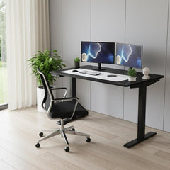 Adjustable Black Stainless Steel Rolling Computer Desk with dual monitors, ergonomic chair, and indoor plants in a modern set