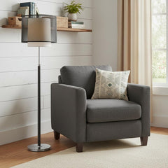 62" Floor Lamp with black and white fabric drum shade next to a gray armchair with a decorative pillow in a cozy room setting