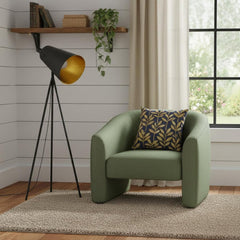 61" Tripod floor lamp with a gray metal cone shade beside a green armchair and a decorative pillow in a cozy room setting.