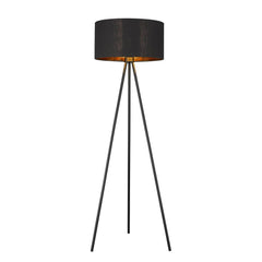 58" Matte Tripod Floor Lamp with a black drum shade and three slender legs, featuring a warm interior glow.
