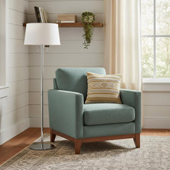 59" Floor Lamp with White Linen Empire Shade beside a teal armchair with a decorative pillow in a cozy room setting.