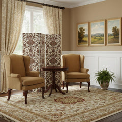 72" Green Folding Three Panel Screen Room Divider in a cozy living space with two chairs, a table, and decorative curtains.