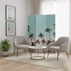 Light green folding three-panel screen room divider with palm tree design, set in a modern living space with two chairs and a