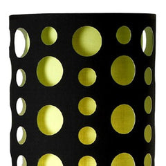 Black and green drum shade of a 66" steel novelty floor lamp featuring circular cutouts.