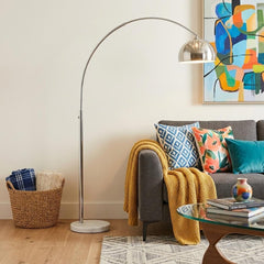 85" White Metal Arched Floor Lamp with Silver Dome Shade, featuring a sleek design beside a cozy sofa with colorful pillows.