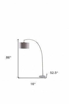 86" beige and antique gold arched floor lamp with a gray drum shade, featuring a sleek design and a sturdy base.