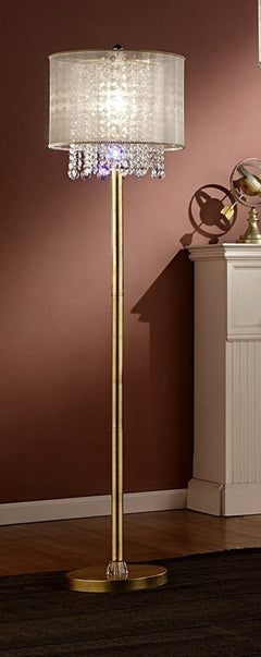 65" gold and white novelty floor lamp with a white fabric drum shade and crystal accents, set against a warm wall.