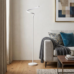 51" White LED Novelty Floor Lamp with a sleek, modern design, featuring a curved top and a stable round base, beside a cozy s