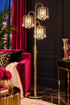 Gold three-light candelabra floor lamp with clear faux crystal shades, featuring an elegant design and a stylish base.