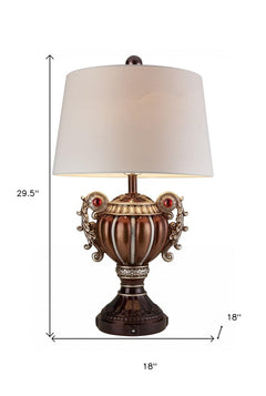 Tall Bronze Urn Shaped Table Lamp with decorative accents and a cream shade, measuring 29.5 inches high and 18 inches wide.