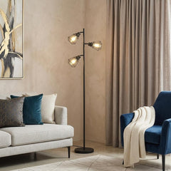 66" black metal three light tree floor lamp with black metal cage shades, featuring a modern design in a cozy living room set