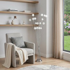 62" Silver 16 LED Novelty Floor Lamp with White globes, featuring a modern design in a cozy living space.