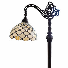 62" brown and white metal floor lamp featuring a decorative arm and a white glass bowl shade with a honeycomb design.
