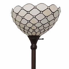 62" brown and white floor lamp featuring a decorative white glass bowl shade with a geometric pattern.