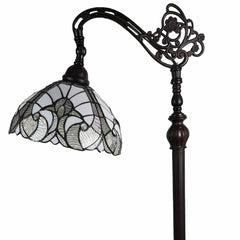 62" brown and white floor lamp featuring an ornate design and a white glass bowl shade with decorative patterns.
