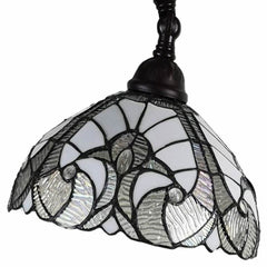 62" brown and white floor lamp featuring a decorative white glass bowl shade with intricate designs and a dark metal base.