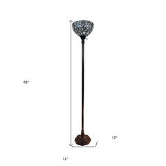 62" brown and white torchiere floor lamp featuring a white peacock feather glass dome shade and an ornate base.