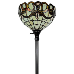 Beige torchiere floor lamp with a decorative red and white flowers glass dome shade, featuring a black metal base.