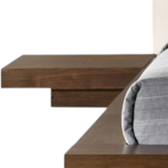Walnut and white wood king bed frame with faux leather accents and attached nightstands, showcasing a modern design.