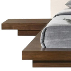 Walnut and white wood king bed frame with faux leather headboard and attached nightstands for modern bedroom decor.