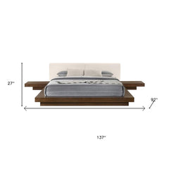 Walnut and white wood king bed frame with faux leather headboard and attached nightstands, dimensions 27" H x 137" W x 92" L.
