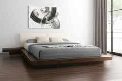 Walnut and white wood king bed frame with faux leather headboard and attached nightstands, featuring a modern design.
