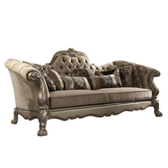 96" Bone Velvet Sofa with decorative toss pillows and elegant gold legs, featuring a tufted design and ornate detailing.