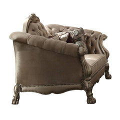 96" Bone Velvet Sofa with gold legs, featuring tufted upholstery and decorative toss pillows for elegant style.