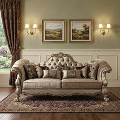 96" Bone Velvet Sofa with gold legs and decorative toss pillows, featuring a tufted back and elegant design in a classic sett