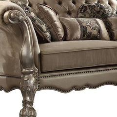 96" Bone Velvet Sofa with gold legs and decorative toss pillows, featuring tufted design and ornate detailing.