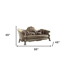 96" Bone Velvet Sofa with toss pillows and gold legs, featuring a tufted design and ornate detailing. Dimensions: 49"H x 46"D