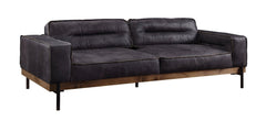 96" Ebony Top Grain Leather Sofa with black legs, featuring a modern design and plush cushions for comfort.