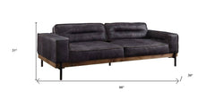 96" Ebony Top Grain Leather Sofa with black legs, featuring a modern design and plush cushions for comfort. Dimensions: 96"x3