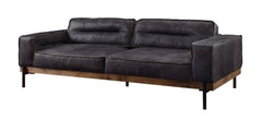 96" Ebony Top Grain Leather Sofa with black legs, featuring a modern design and plush cushions for comfort.