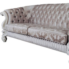 Ivory velvet damask sofa with tufted design, bone legs, and matching toss pillows, measuring 99 inches.