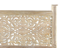 White carved floral design on a distressed solid wood headboard of a king bed frame by Wellnesslifeclub74.