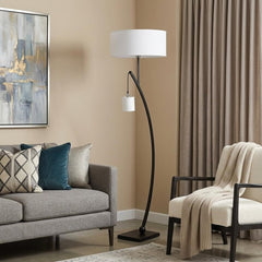 59" Matte Black Dual Arc Floor Lamp with White Drum Shade, featuring a sleek design and a cozy living room setting.