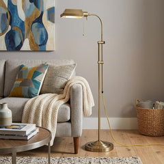 57" Brass Adjustable Traditional Floor Lamp with Bronze Square Shade, featuring a sleek design beside a cozy sofa and decor.