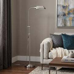 57" Nickel Adjustable Traditional Floor Lamp with square nickel shade, standing next to a cozy sofa and coffee table.