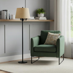 62" Bronze Four Light Floor Lamp with Beige Fabric Square Shade beside a green armchair in a cozy, modern living space.