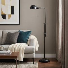 58" Bronze Adjustable Traditional Floor Lamp with a dome shade, featuring a sleek design beside a cozy sofa and coffee table.