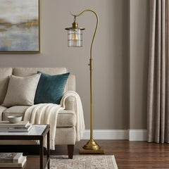 60" Brass Traditional Floor Lamp with a bronze transparent glass drum shade, featuring a curved arm and a stylish base.