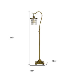 60" Brass Traditional Floor Lamp with a bronze transparent glass drum shade, featuring a curved neck and square base.
