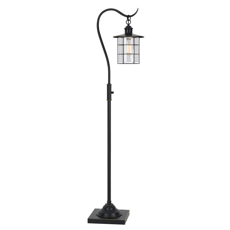 Antiqued bronze lantern style floor lamp with a hanging glass cylinder inside a metal cage frame.