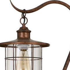 60" rusted traditional floor lamp featuring a rust transparent glass drum shade and vintage-style bulb.