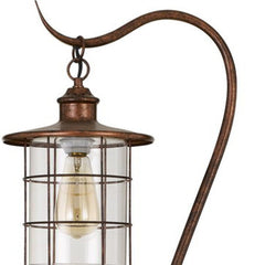 60" rusted traditional floor lamp featuring a rust transparent glass drum shade and a curved handle design.