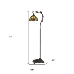 61" bronze floor lamp with a green and yellow glass dome shade, featuring an elegant curved design and floral accents.