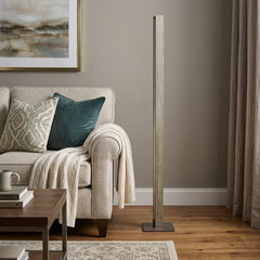 61" Brown LED Traditional Shaped Floor Lamp with a sleek design, positioned next to a cozy sofa and decorative throw pillows.