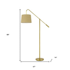 68" brass adjustable floor lamp with an antiqued brass drum shade, featuring a sleek design and a round base.