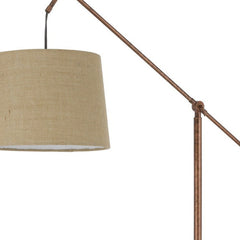 68" rusted adjustable floor lamp with a traditional design and a rust drum shade, featuring a metal arm and fabric shade.
